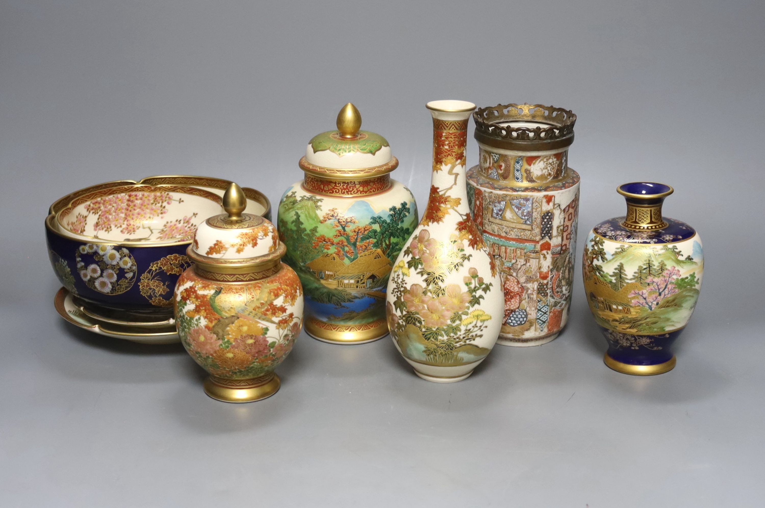 A collection of Japanese Satsuma, vases, bowls and lidded jars, 9 items in total, tallest item,18 cms high.